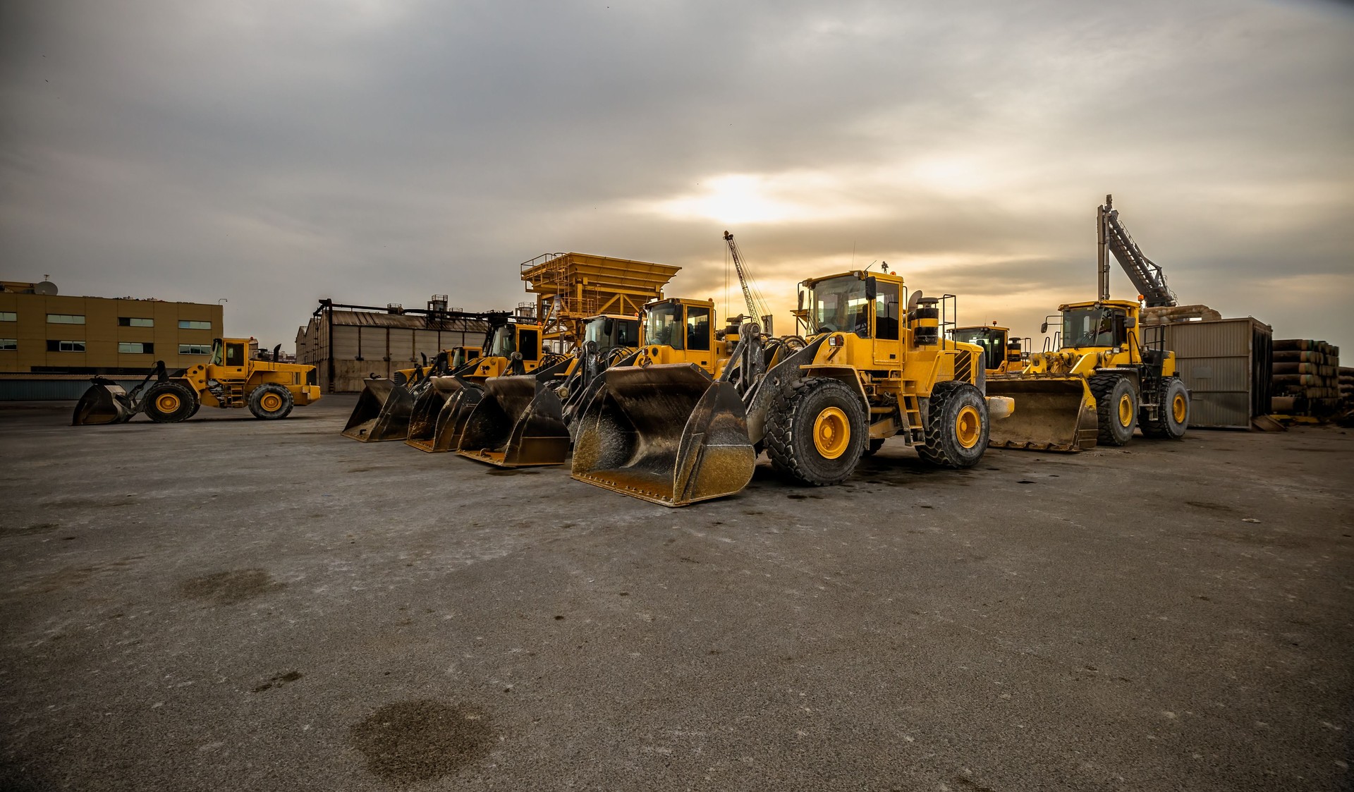 yellow wheel loader or bulldozer in formation. Earthmoving and aggregates. Construction work.