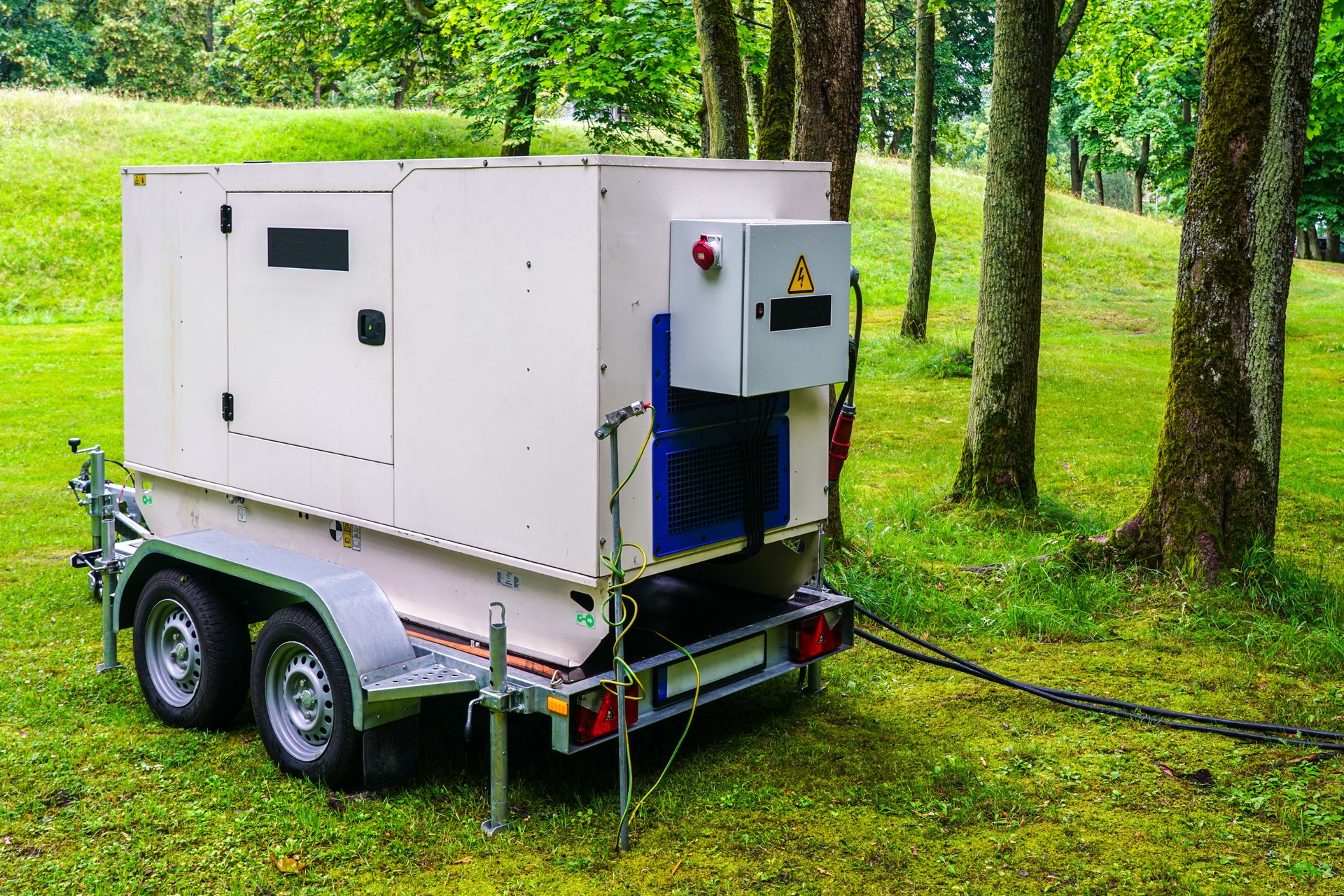 Connected large rental diesel generator on a mobile trailer for outdoor event power supply